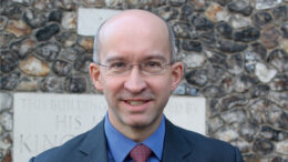 Head and shoulders photo of Mr William Nye LVO standing outside Church House in Westminster