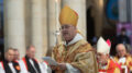 Archbishop Stephen Cottrell in gold robes and mitre addressing a congregation, as he is surrounded by seated bishops and clergy