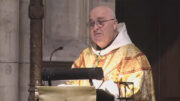 The Archbishop of York wearing golden robes as he preaches a sermon in York Minster