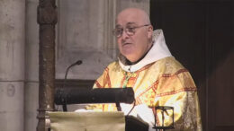 The Archbishop of York wearing golden robes as he preaches a sermon in York Minster